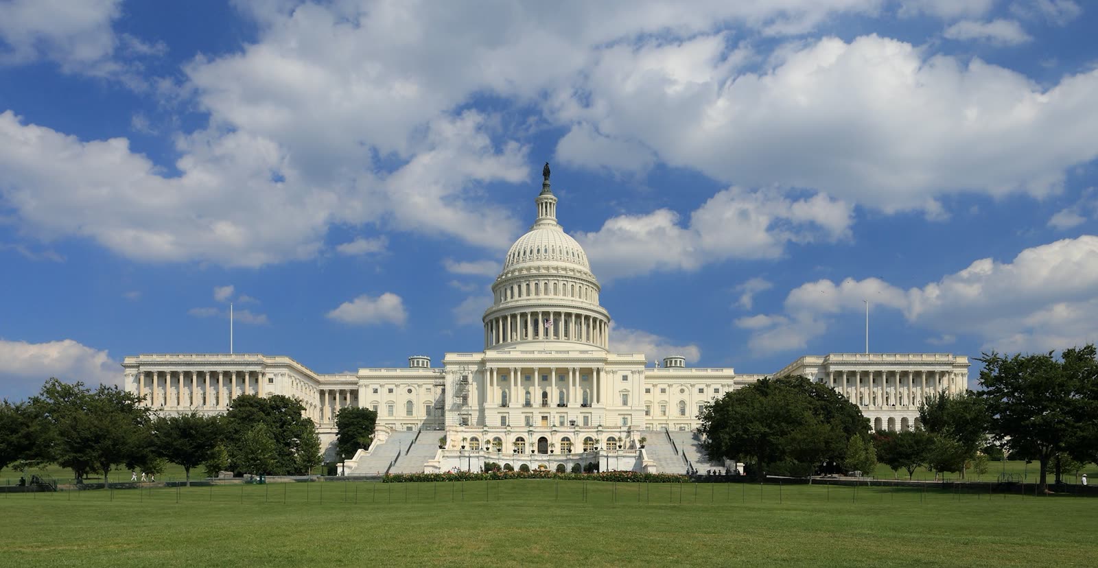 The United States Capitol in Washington, D.C., under a blue daytime sky